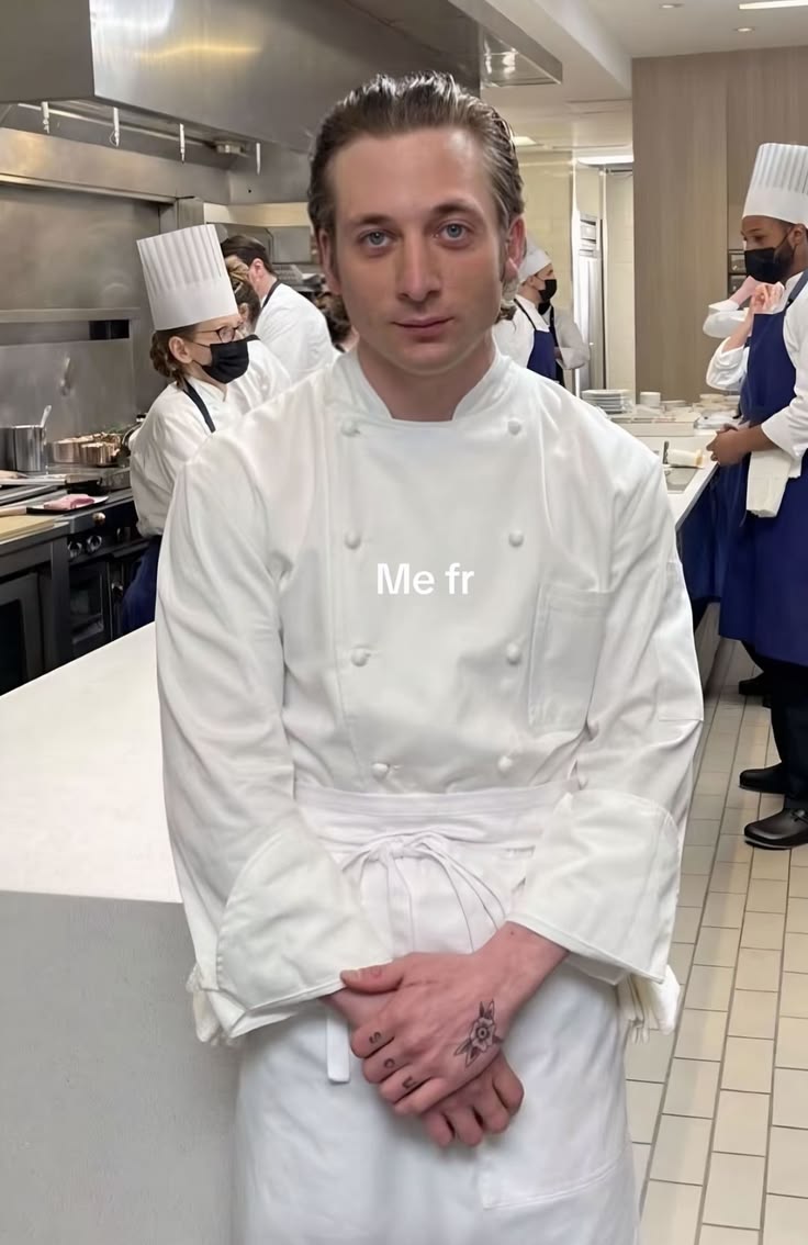 A chef standing in a professional kitchen